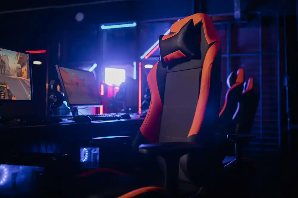 Dramatic stage lighting illuminating an esports competition setup