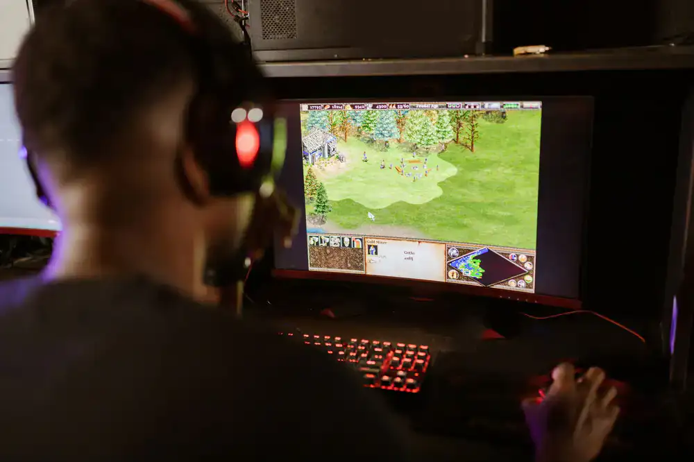 Players looking at a monitor discussing strategic plays
